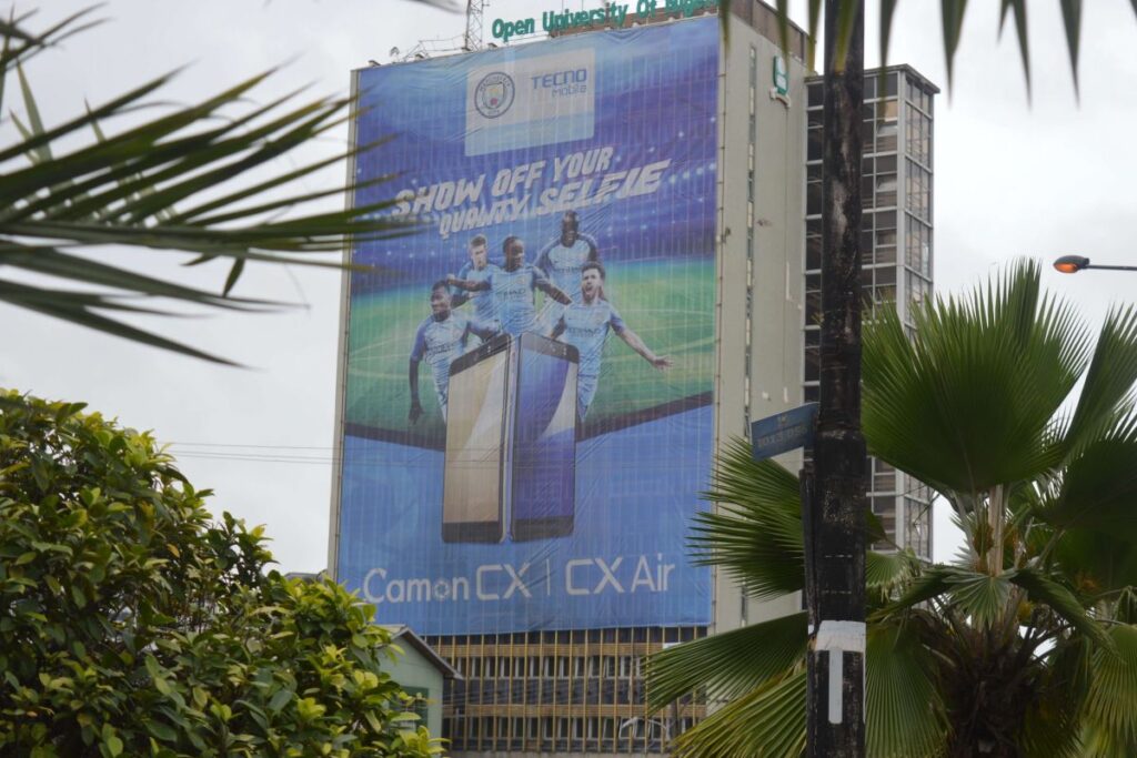 Wall Drape Billboard On NOUN Head Quarter Building,Lagos Optimum