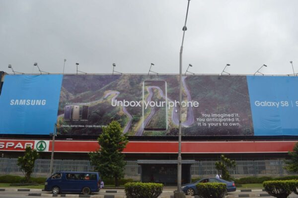 A Large Format Wall Drape Billboard capturing attention in the hustling city of lagos