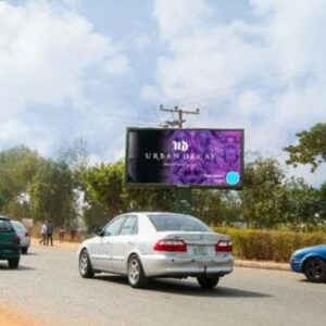 backlit billboard lighting up the city of abuja