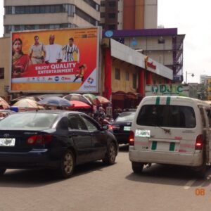 Wall Drape Billboard mounted on a buildinf and capturing attention in the streets of Lagos