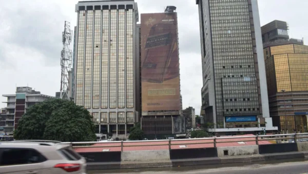 Wall drape billboard standing tall and capturing attention in the city of Lagos, Nigeria