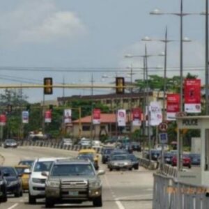 Lamp post billboard in Lagos busy street