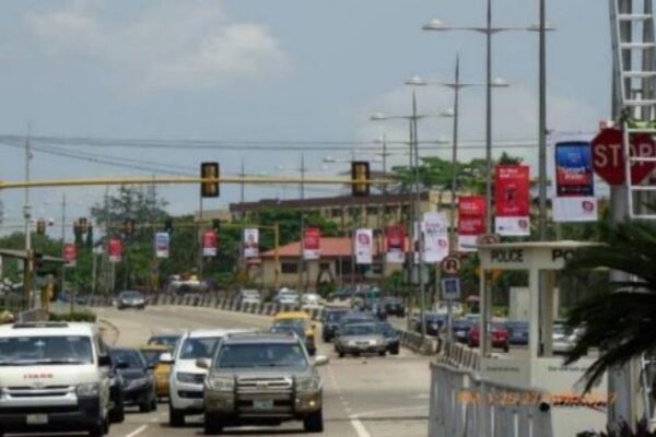 Lamp post billboard in Lagos busy street