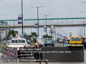 Lamp-post billboard at Airport Road, Orile, Oshodi, Lagos State, Nigeria