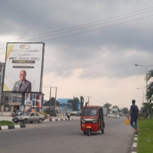 portrait billboard in the busy city of Awka ibom