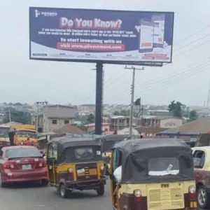 a unipole billboard standing tall in the city of ibadan