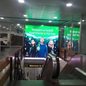 LED Billboard at Murtala Muhammed International Airport in Lagos, displaying an engaging advertisement near escalators for maximum traveler visibility.