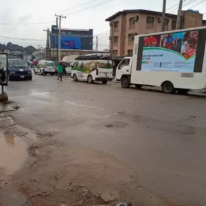 Mobile LED double-sided advertising truck displaying a colorful campaign on a busy street in Lagos, Nigeria