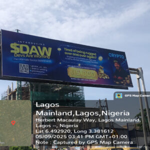 Gantry billboard along Herbert Macaulay Way Lagos Mainland displaying a crypto campaign with clear roadside visibility.