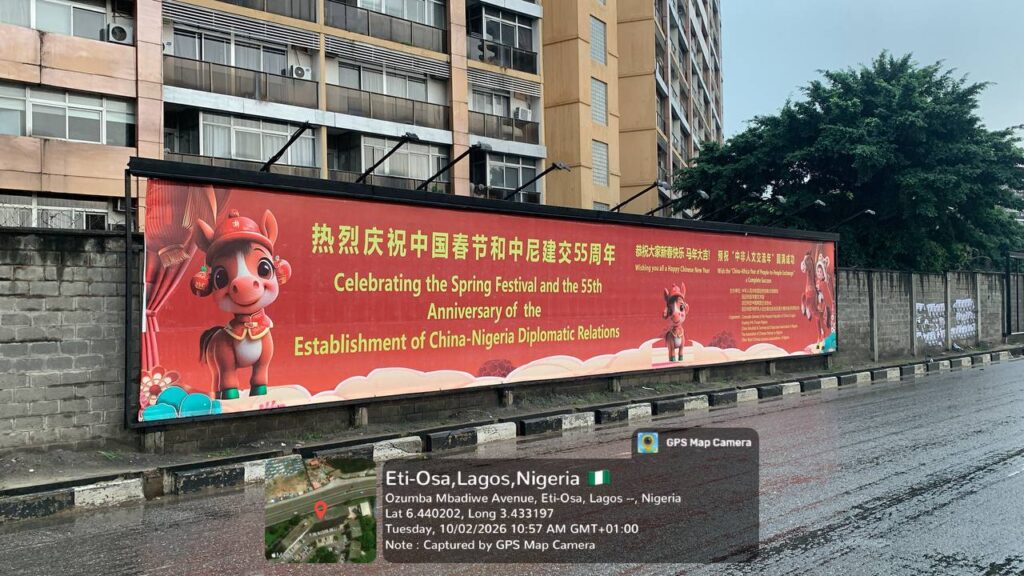 Wall drape billboard on Ozumba Mbadiwe Avenue, Eti-Osa, Lagos showing large outdoor advertising display with high roadside visibility.