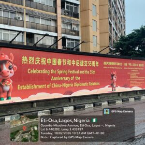 Wall drape billboard on Ozumba Mbadiwe Avenue, Eti-Osa, Lagos showing large outdoor advertising display with high roadside visibility.